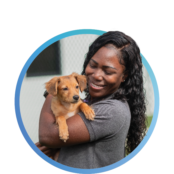 a woman holding a dog