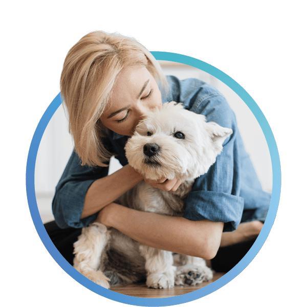 a woman hugging a dog