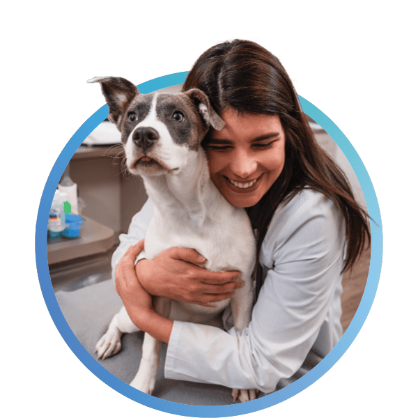 a woman holding a dog