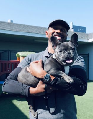 a man holding a dog