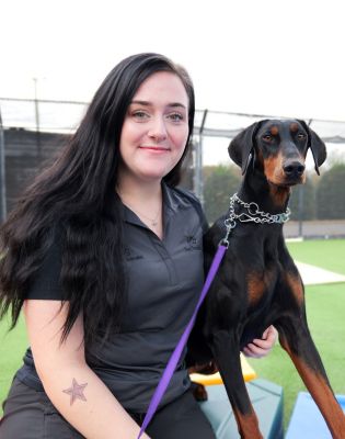 a woman holding a dog