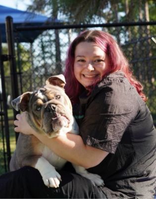 a woman holding a dog