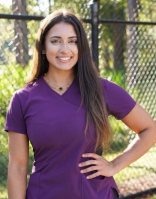 a woman in a purple shirt