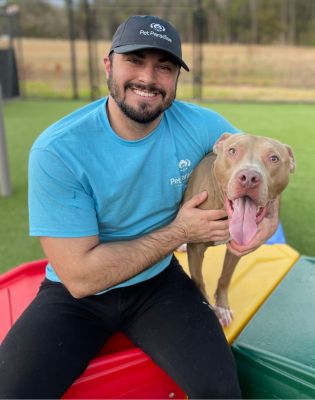 a man holding a dog