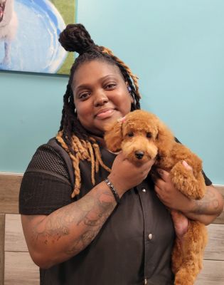 a woman holding a dog